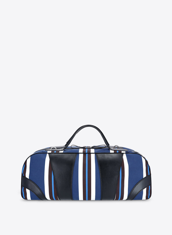 Striped duffel bag with blue, white, and black pattern on a light gray background - Dries Van Noten