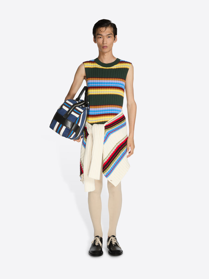 Person wearing a colorful striped dress with a bag on a white background - Dries Van Noten