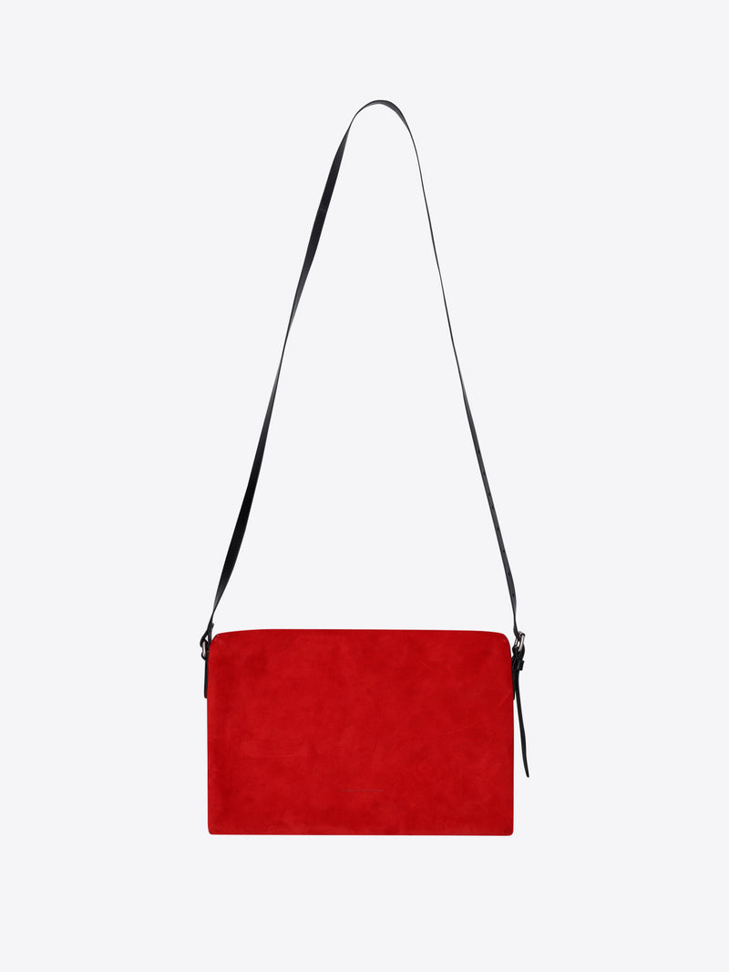 Red handbag with a black strap on a white background - Dries Van Noten
