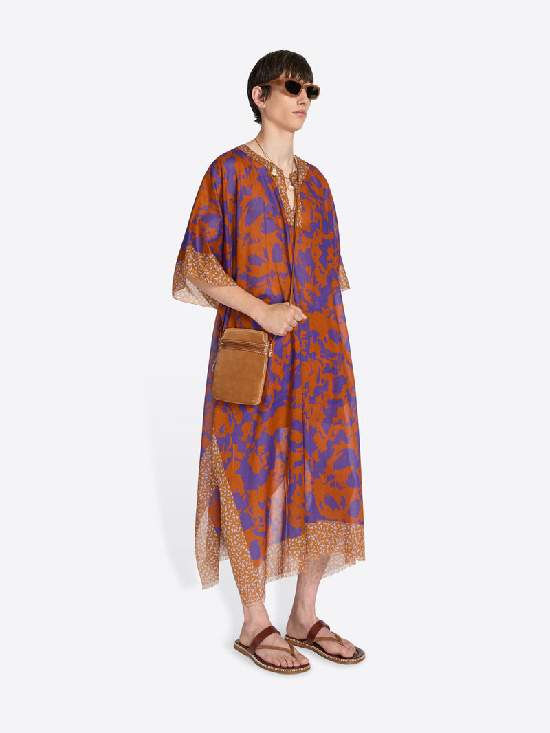 Woman wearing a patterned dress with a brown bag on a white background - Dries Van Noten