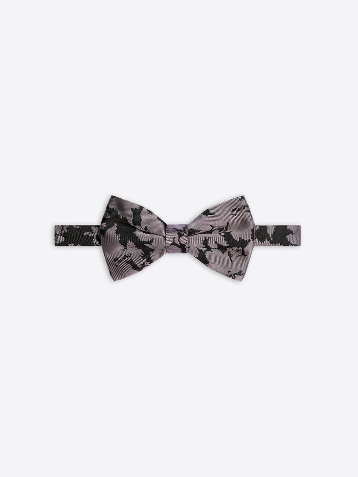 Gray bow tie with black floral pattern on a white background