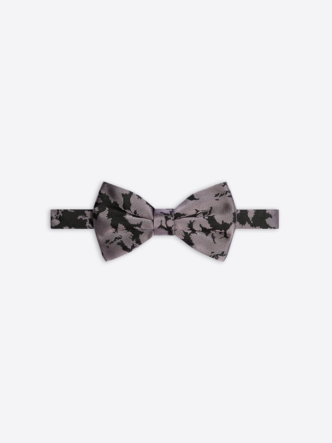 Gray bow tie with black floral pattern on a white background