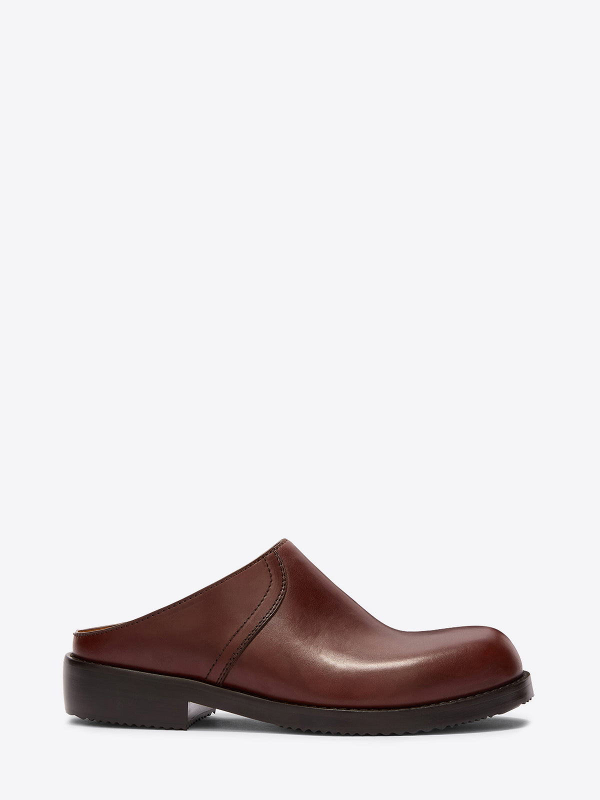 Brown leather clog shoe on a white background