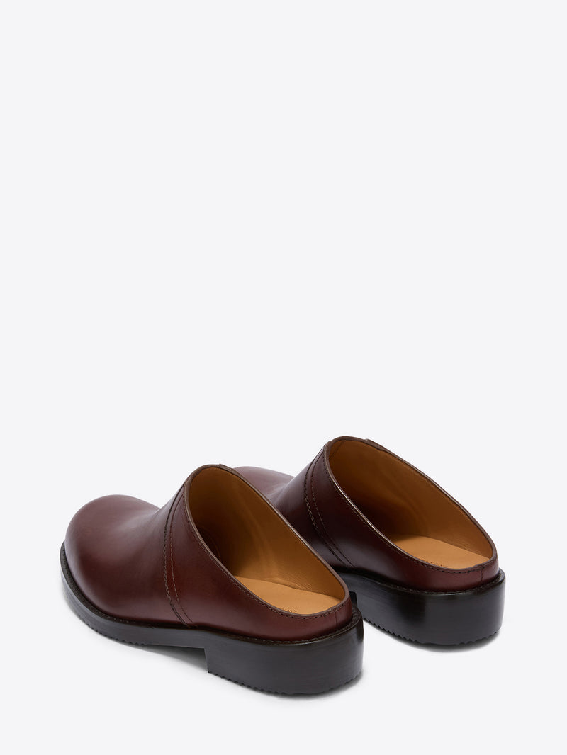 Pair of brown leather shoes on a white background