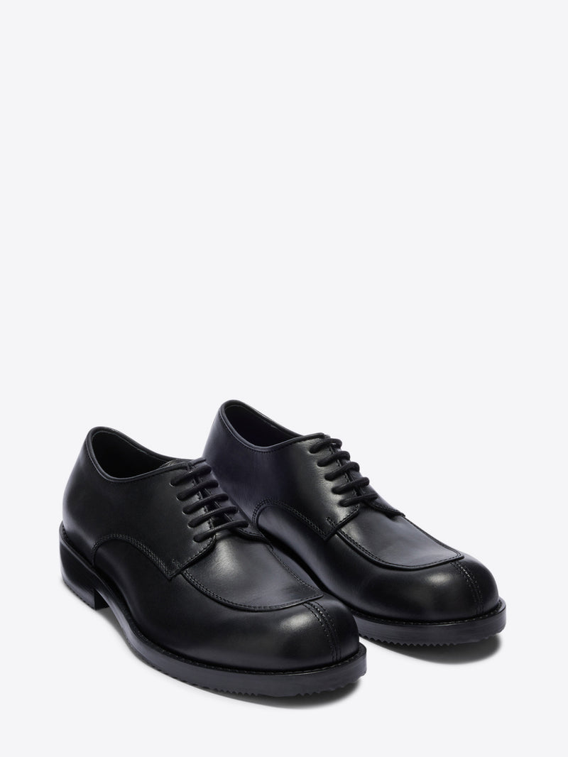 Pair of black leather shoes on a white background - Dries Van Noten