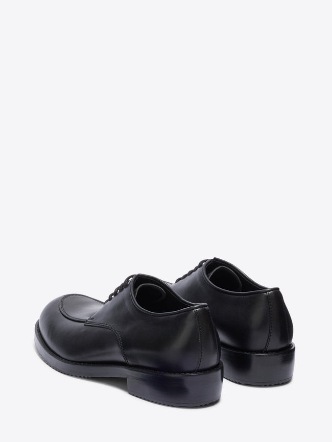 Pair of black leather shoes on a white background - Dries Van Noten