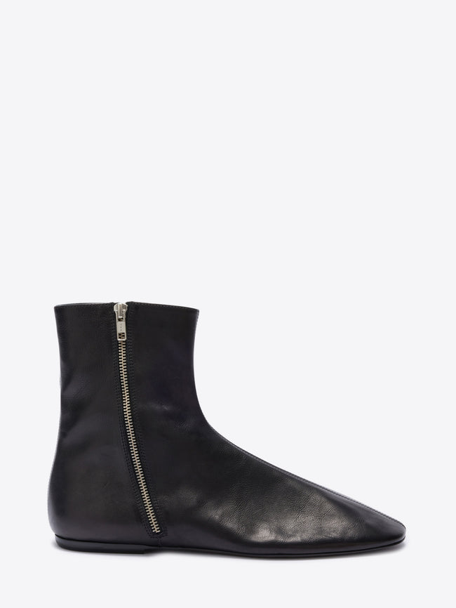 Black ankle boot with a zipper on a white background