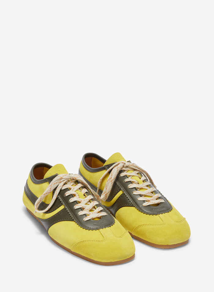 Yellow and gray sneakers on a white background