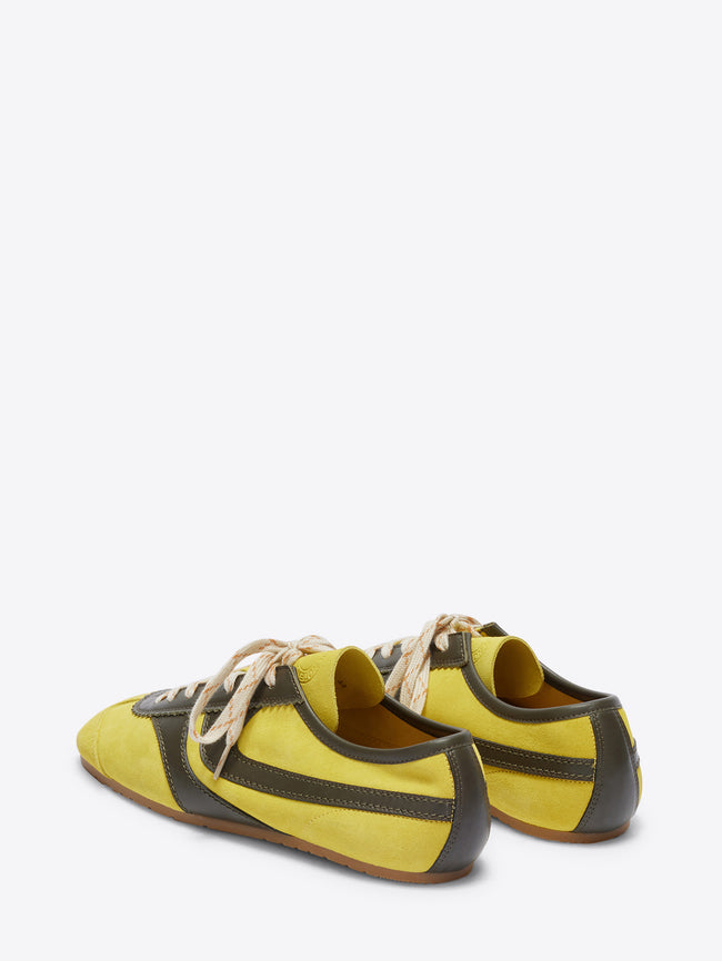 Yellow and gray sneakers on a white background