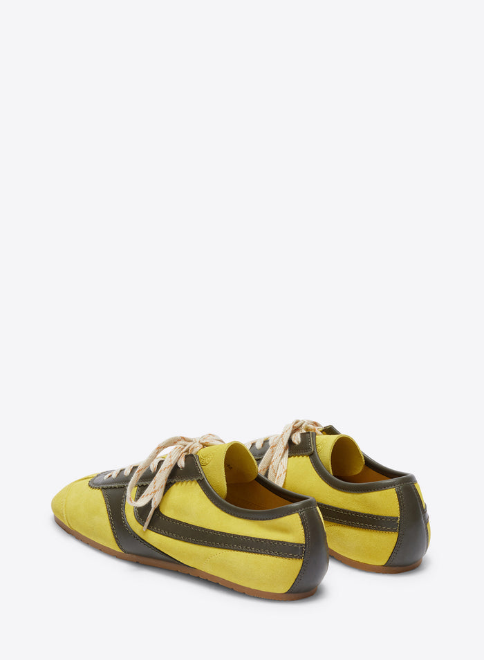 Yellow and gray sneakers on a white background