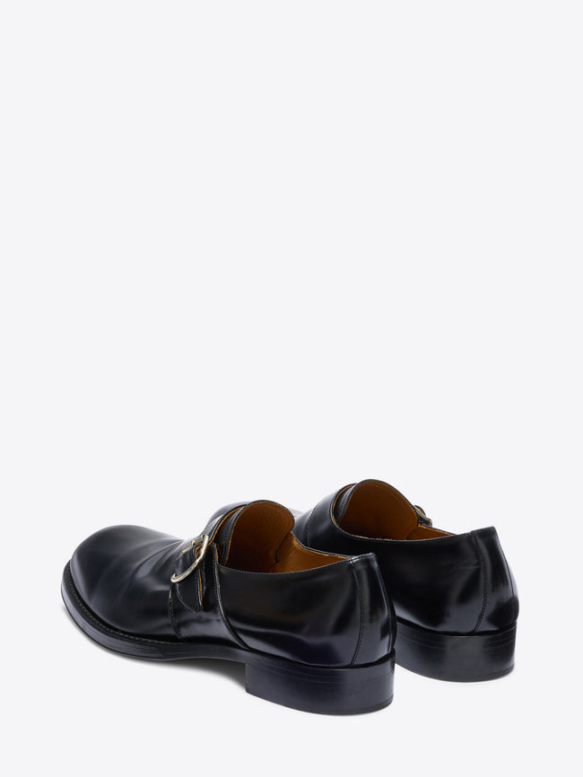 Pair of black leather shoes on a white background