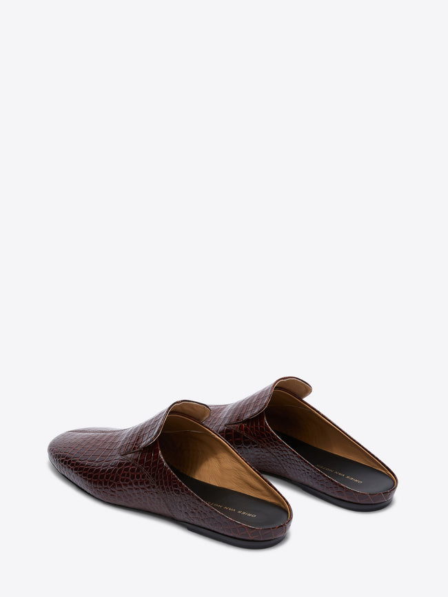 Pair of brown crocodile-textured loafers on a white background