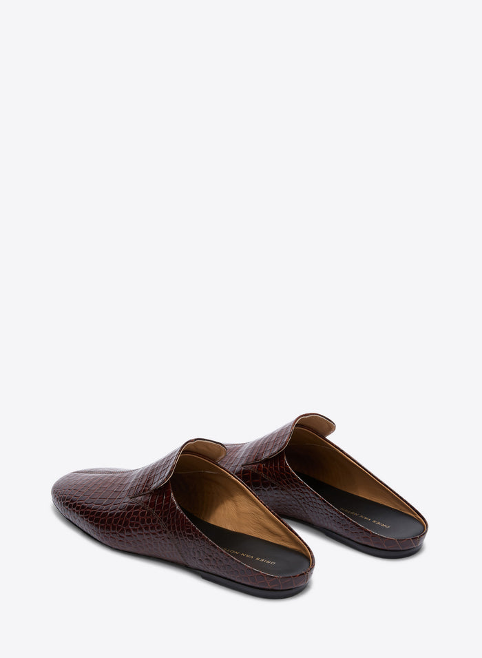 Pair of brown crocodile-textured loafers on a white background