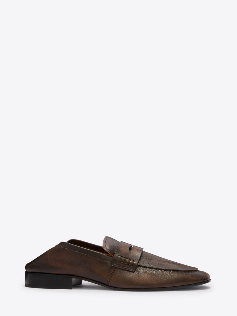 Brown leather loafer shoe on a white background