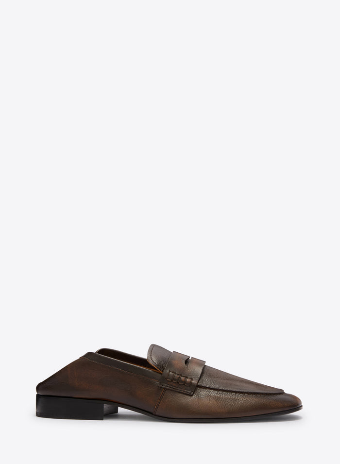 Brown leather loafer shoe on a white background