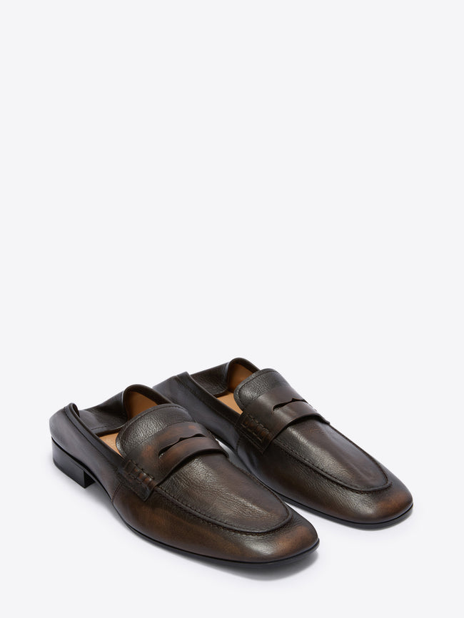 Pair of brown leather loafers on a white background
