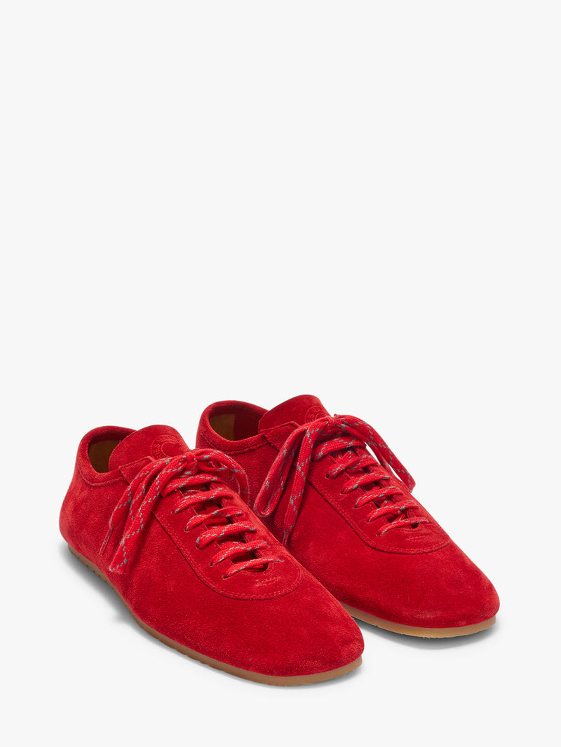 Red sneakers on a white background
