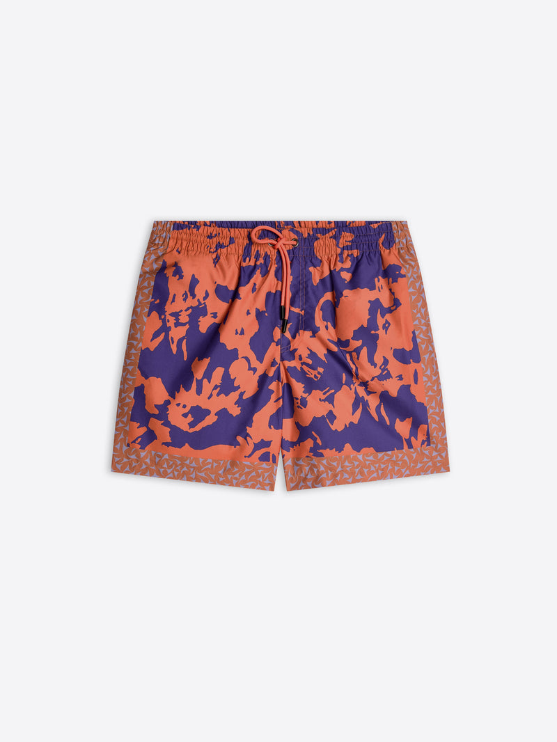 Orange and blue camouflage swim shorts on a white background