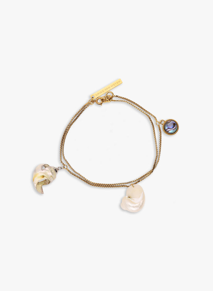 Gold bracelet with charms on a white background