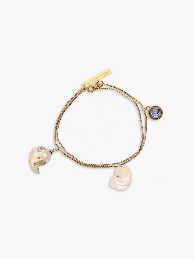 Gold bracelet with charms on a white background