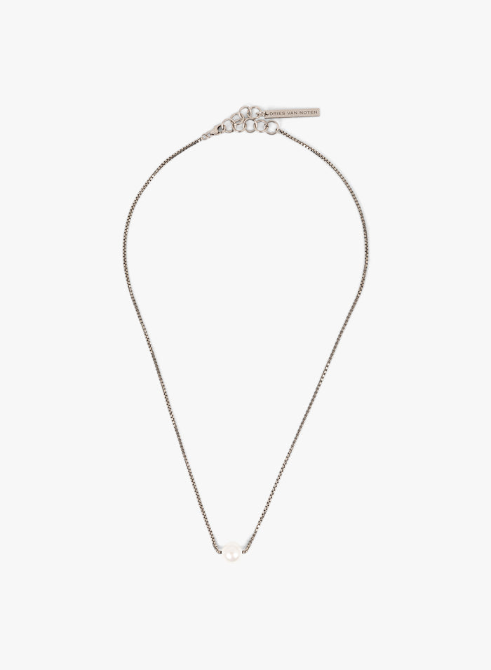 Silver necklace with a pearl on a white background