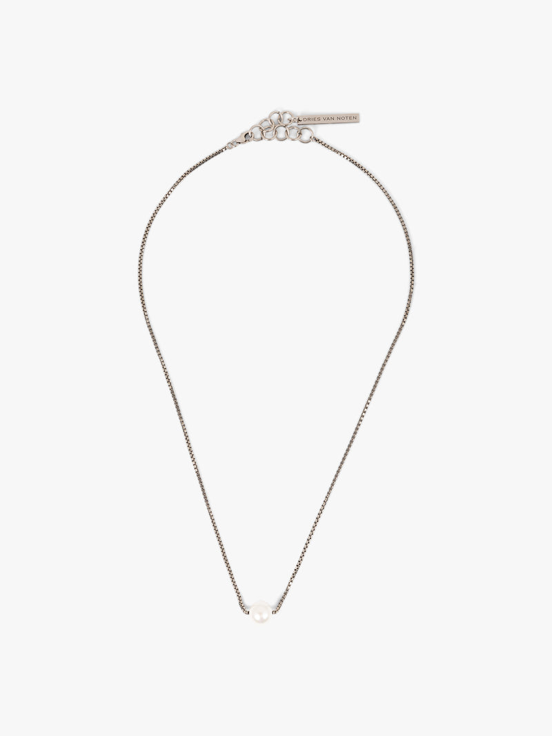 Silver necklace with a pearl on a white background