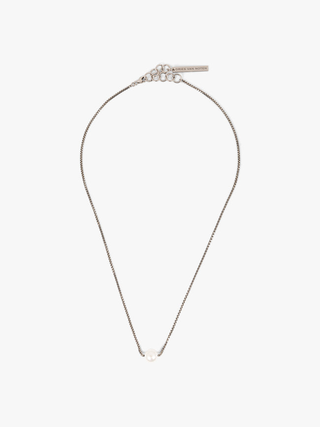 Silver necklace with a pearl on a white background