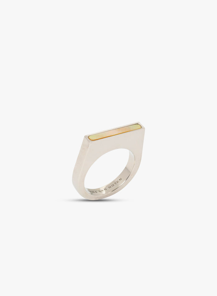Silver ring with a gold accent on a white background