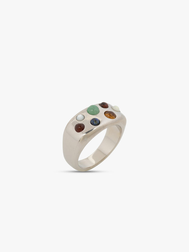 Silver ring with embedded stones on a white background. 