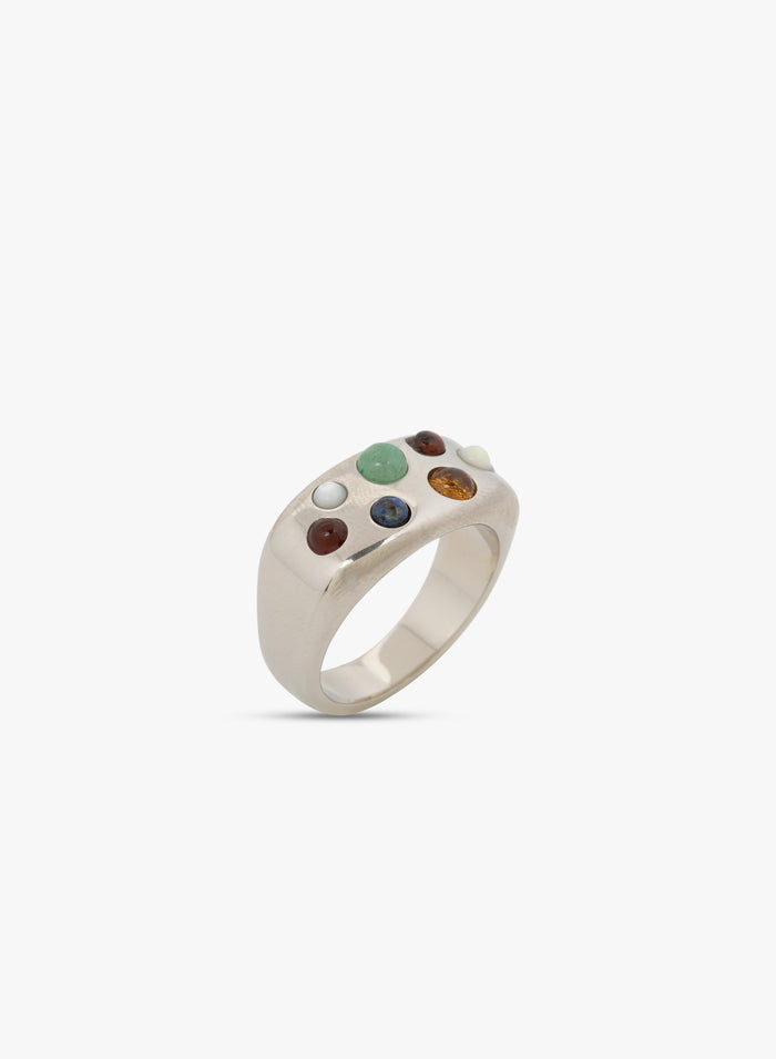 Silver ring with embedded stones on a white background. 