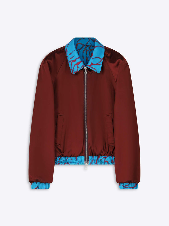 Brown jacket with blue collar and cuffs on a white background