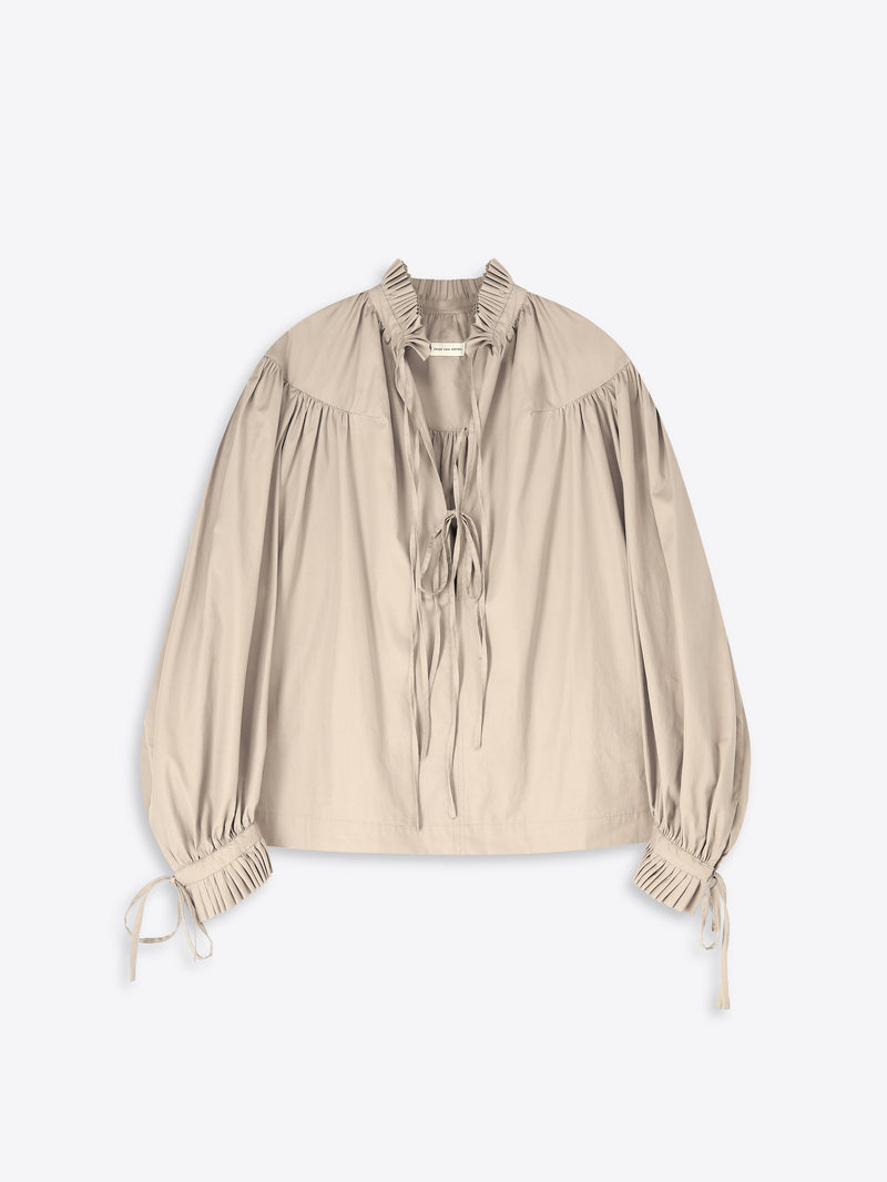 Beige blouse with long sleeves and tie details on a white background