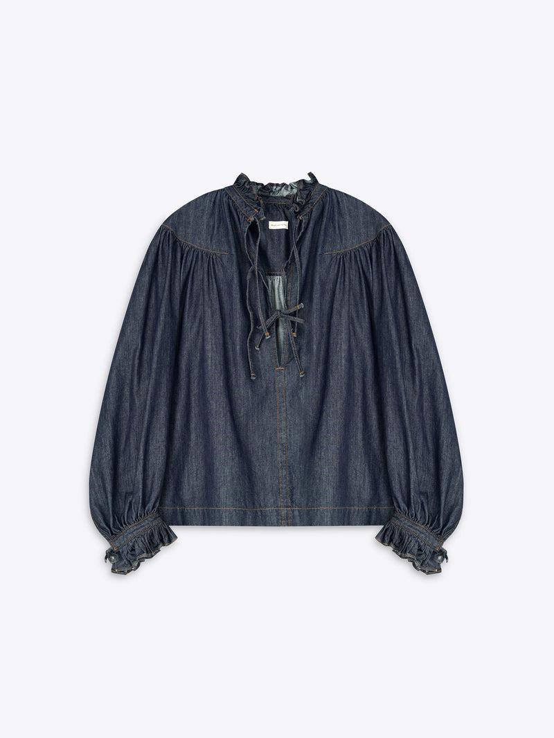 Denim blouse with ruffled sleeves on a light gray background