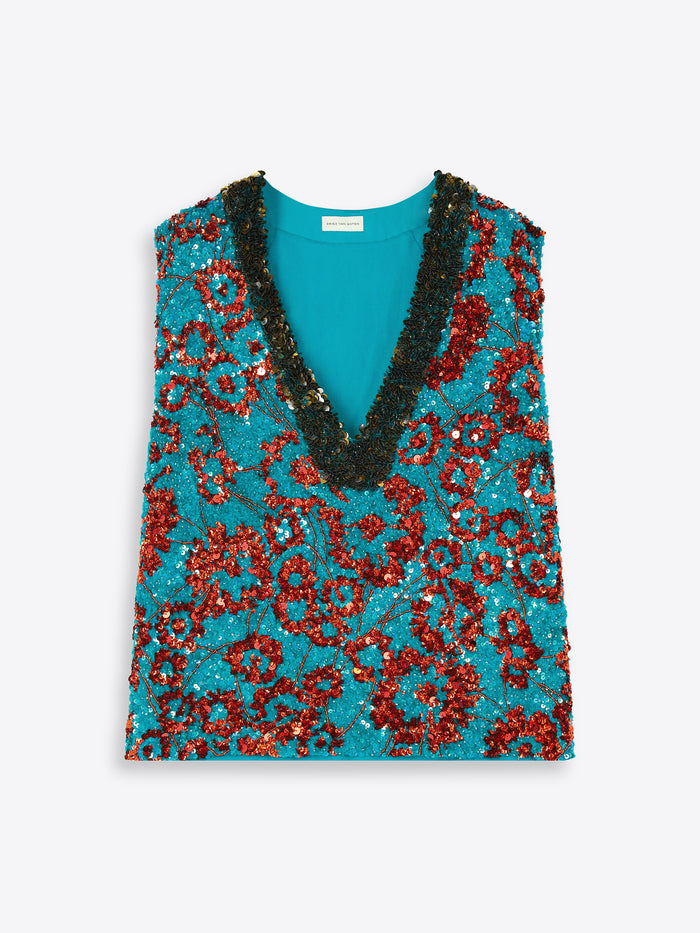 Turquoise top with red sequin vest on a white background