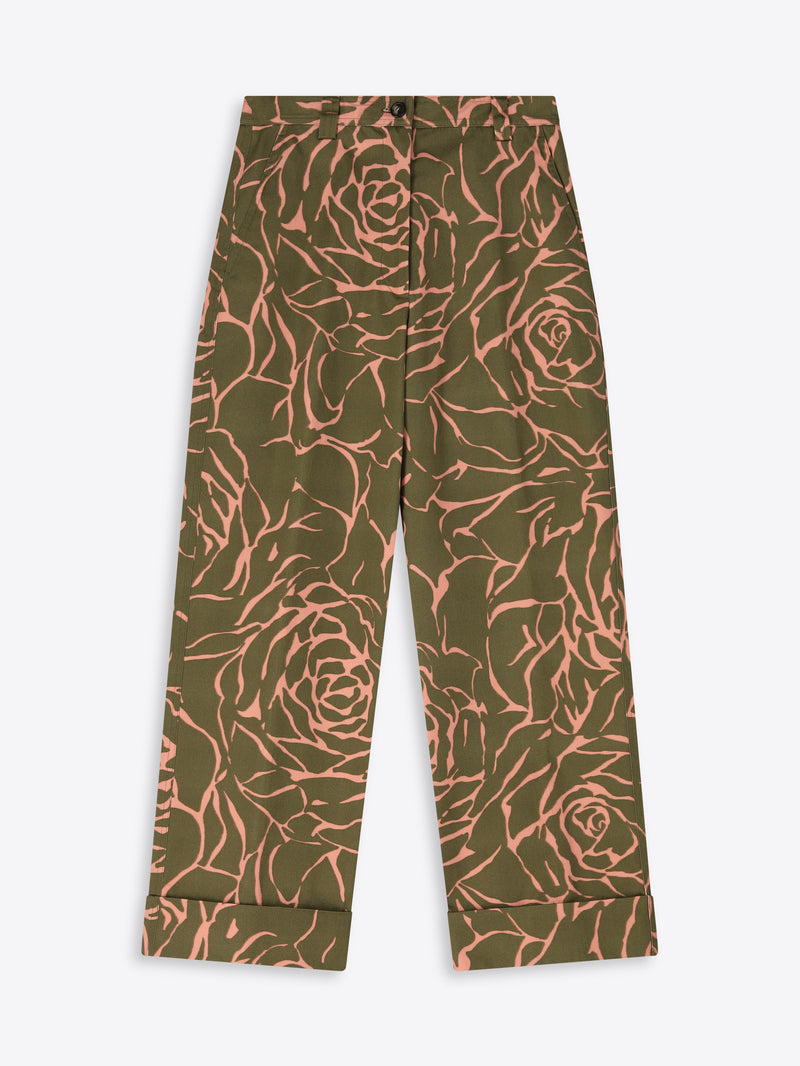 Green pants with pink floral pattern on a white background