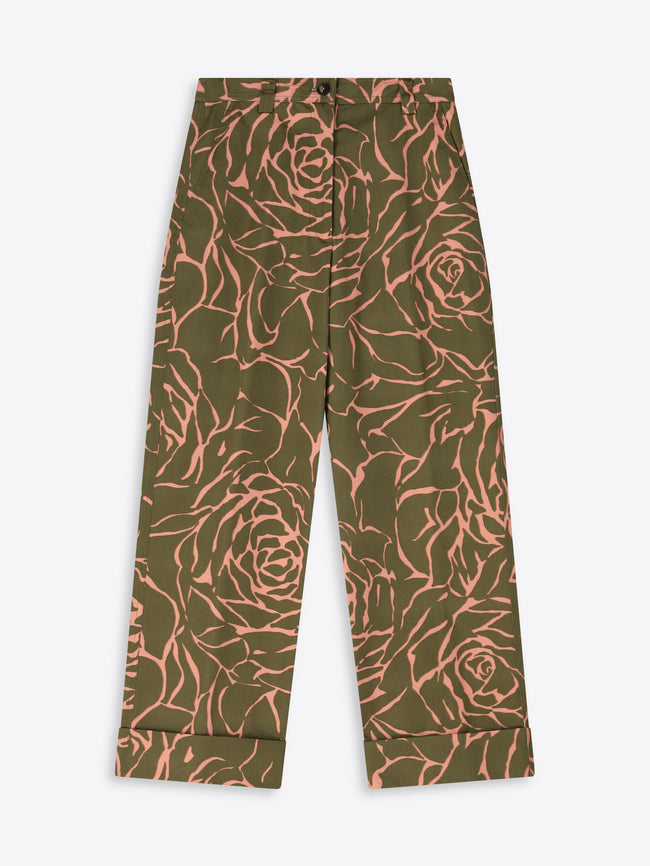 Green pants with pink floral pattern on a white background