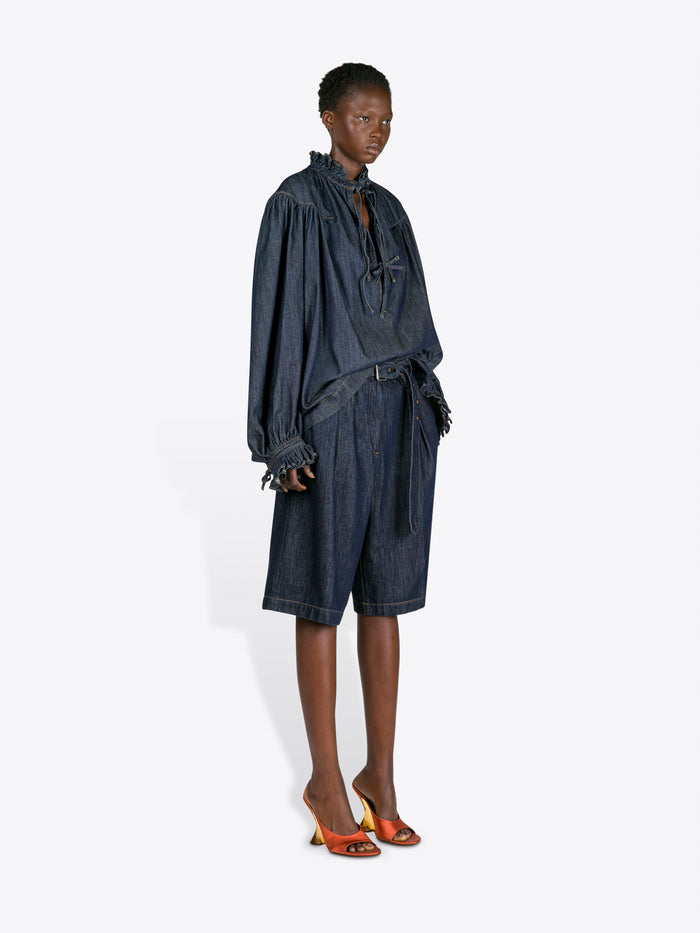 Person wearing a dark denim outfit on a white background - Dries Van Noten