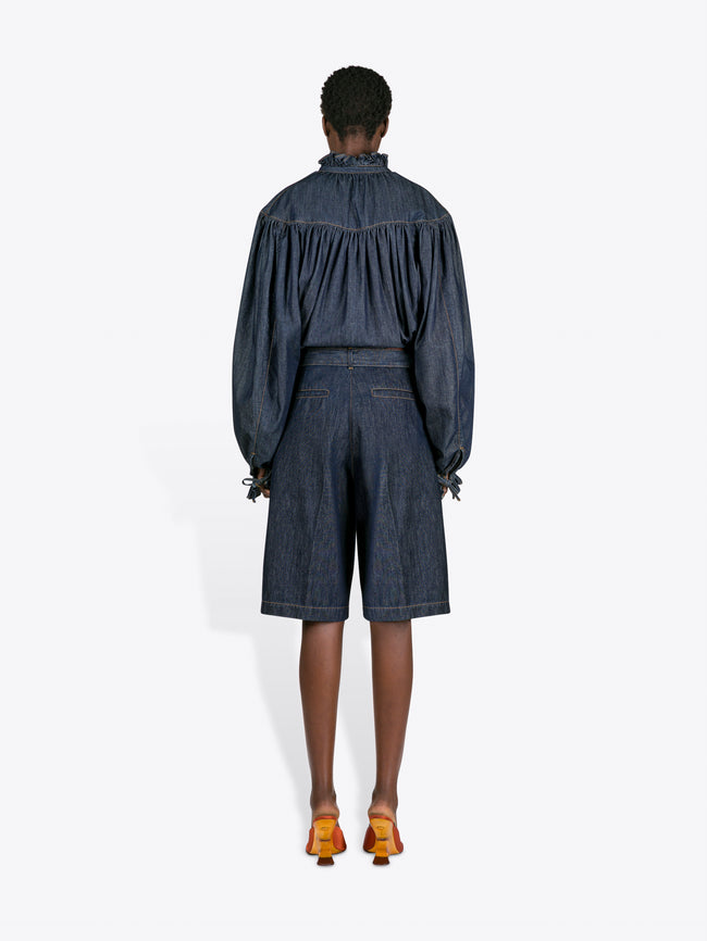 Person wearing a denim outfit with a white background - Dries Van Noten