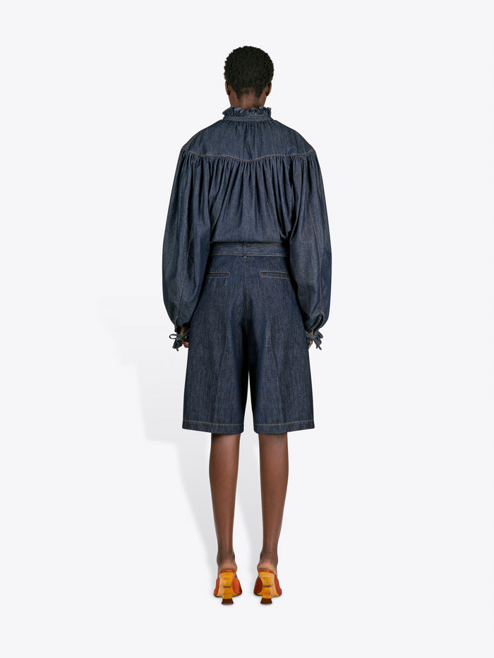 Person wearing a denim outfit with a white background - Dries Van Noten