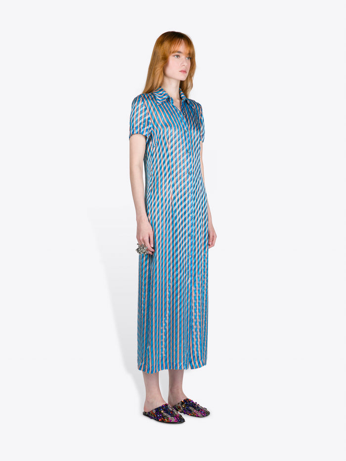 Woman wearing a blue patterned dress on a white background - Dries Van Noten