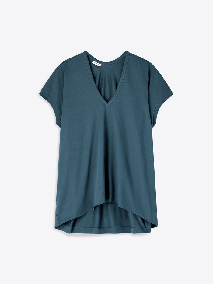 Teal t-shirt with a V-neck on a light gray background