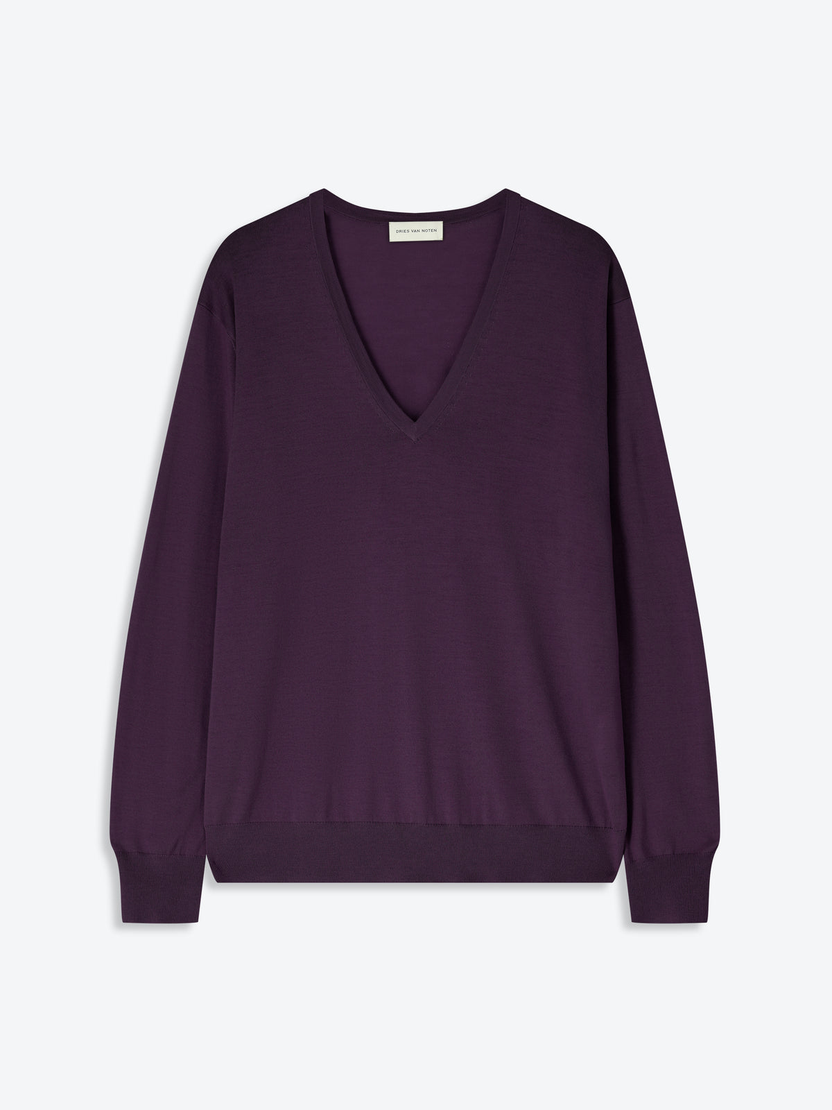 Purple sweater on a light gray background