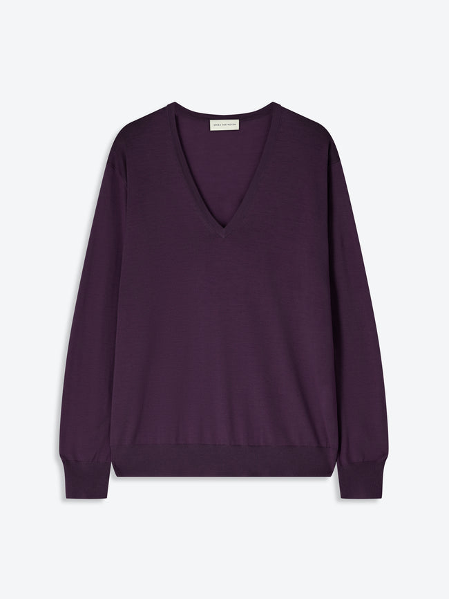 Purple sweater on a light gray background