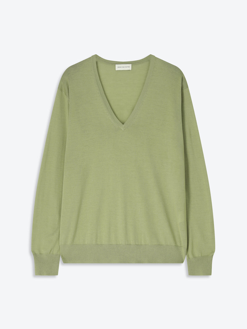 Green sweater on a white background