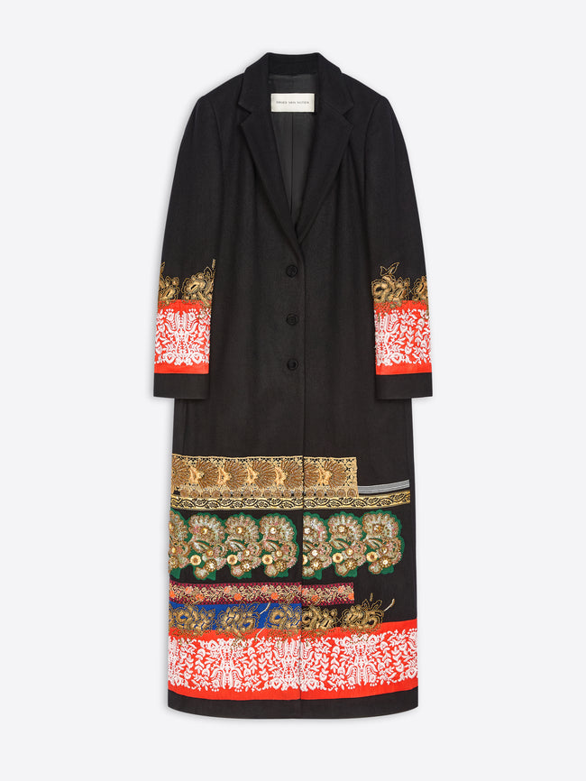 A black long coat with ornate multicolor embroidered and printed patterns concentrated at the cuffs and lower hem, shown flat against a light gray background.