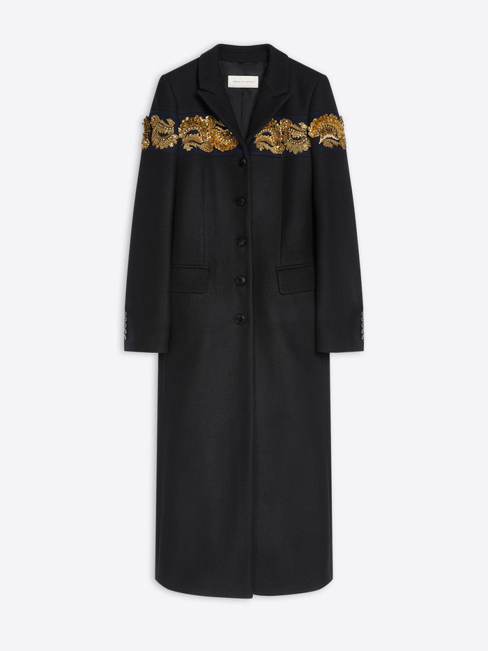 A long black coat with ornate gold embroidered detailing across the shoulders, shown against a light gray background.