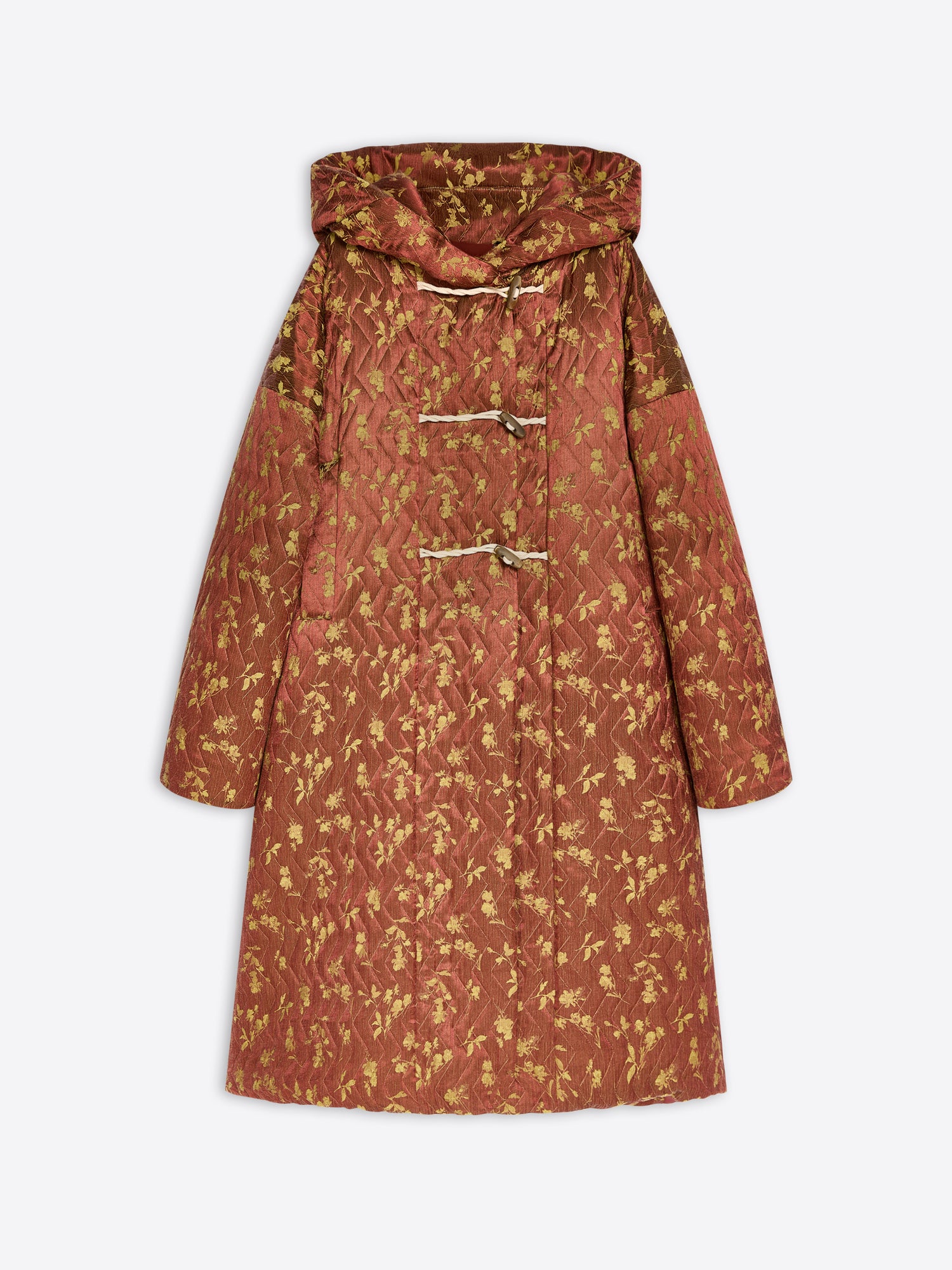 A hooded quilted coat with a rust-orange and gold floral pattern, featuring toggle closures on the front, shown against a light gray background.