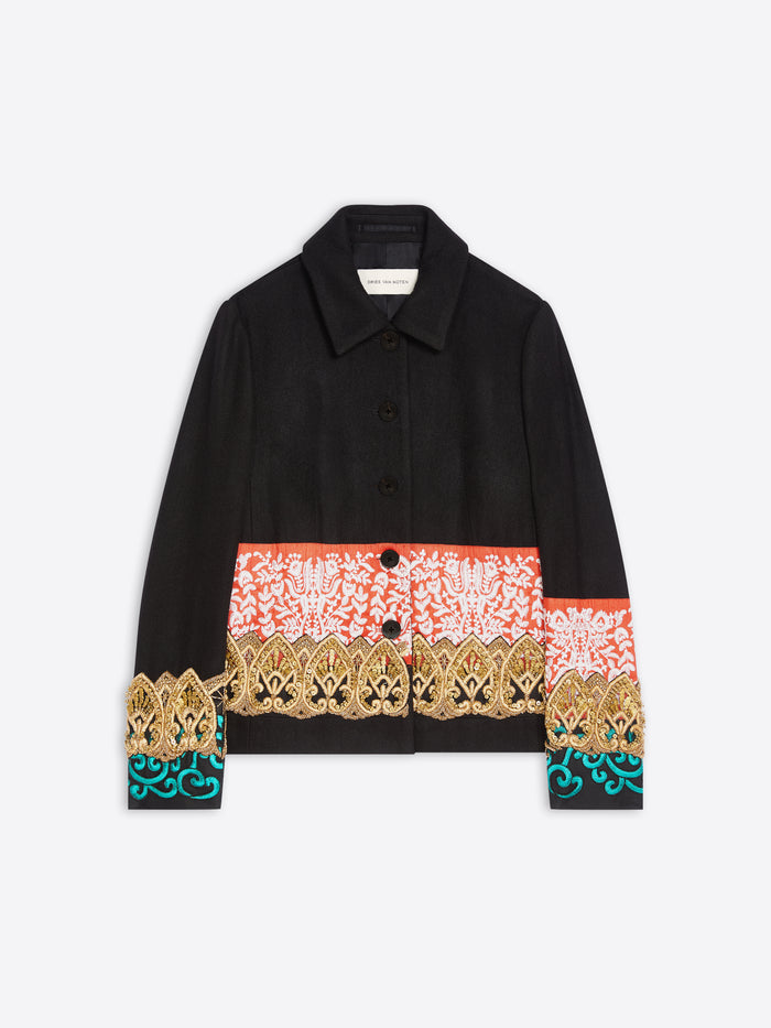 A black long-sleeve button-up jacket featuring a wide multicolor patterned band across the waist and cuffs, with gold and turquoise details, shown on a light gray background.