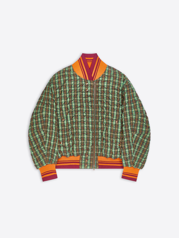 A green and brown plaid bomber jacket with orange and burgundy striped ribbed collar, cuffs, and hem, displayed flat against a light gray background.