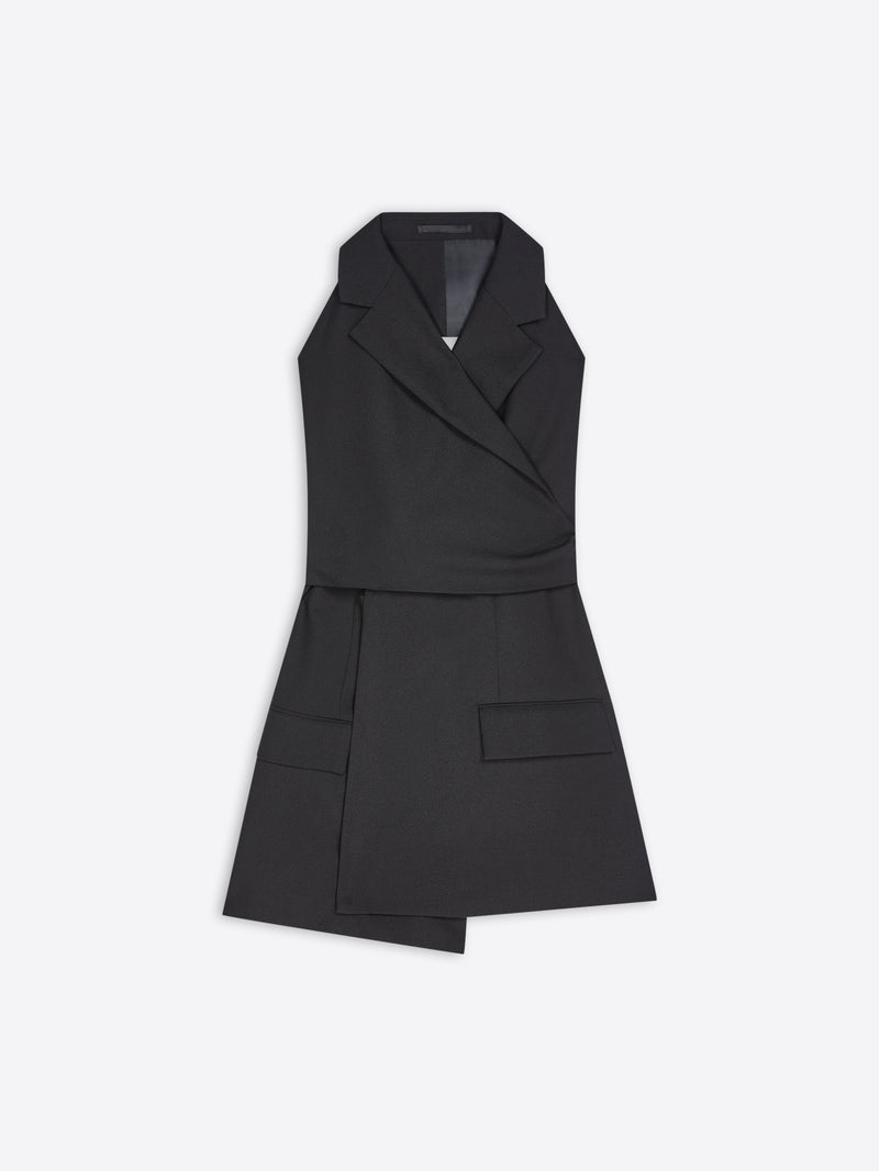 A black sleeveless wrap-style blazer top with a structured collar, asymmetrical front, and flap pockets, shown on a light gray background.